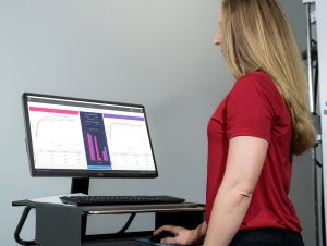 Clinician reviews automated charts and graphs from a Functional Capacity Evaluation report