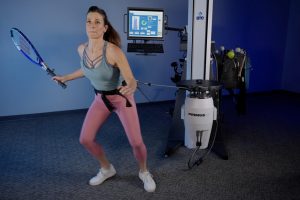 Woman using machine for exercises